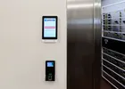 Show photo 2: Paznic touch screen and fingerprint reader mounted beside the stainless steel vault day gate