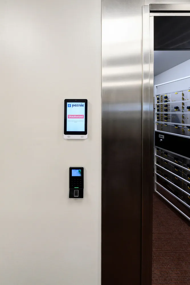 Paznic touch screen and fingerprint reader mounted beside the stainless steel vault day gate