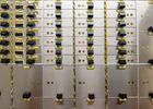 Show photo 4: Close-up of a safe deposit box nest with numbered yellow tags and lever locks