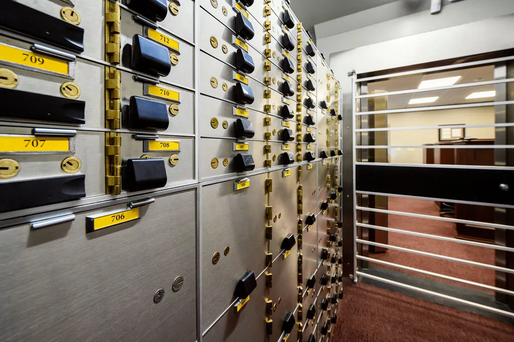Safe deposit box vault interior with the day gate open onto the branch