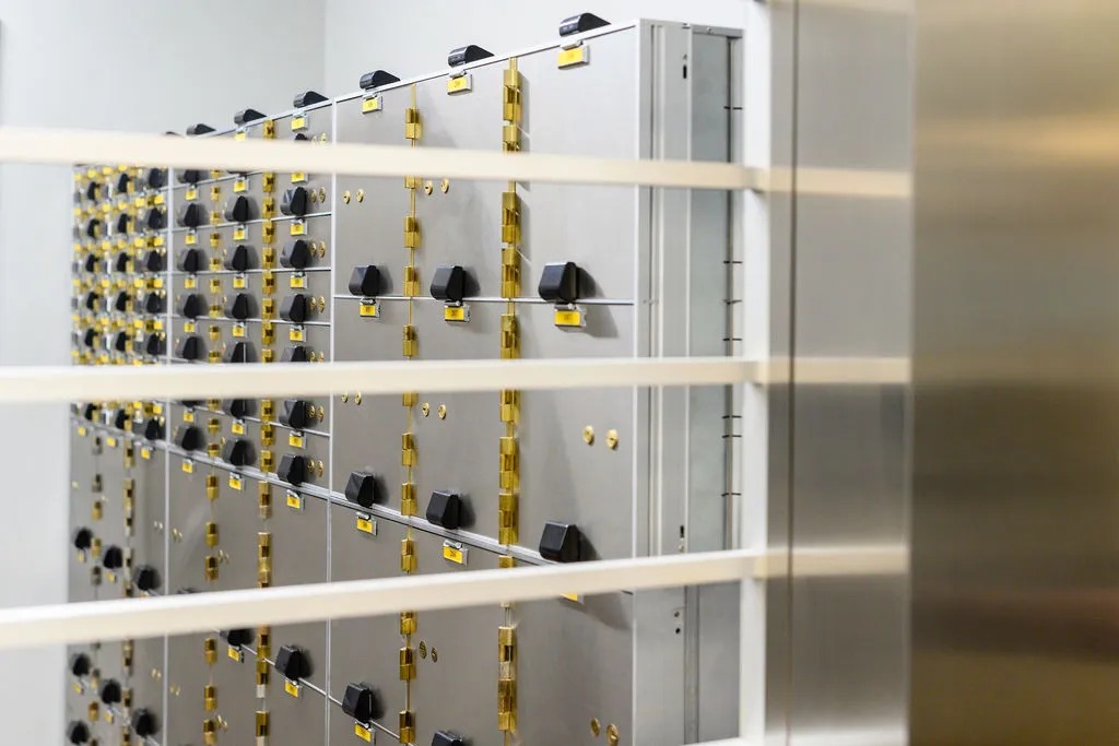 Rows of safe deposit boxes along the vault wall
