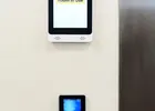Show photo 19: Paznic touch screen showing Room In Use above the fingerprint reader